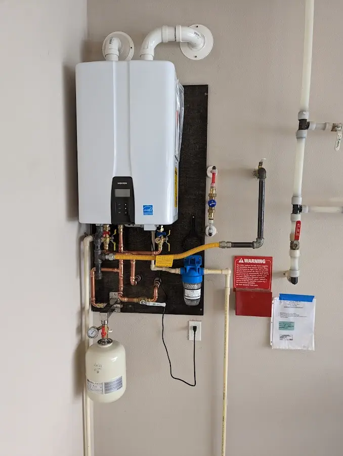 Professional plumber installing copper piping in a Stephenville home